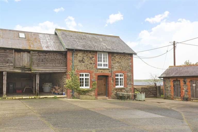 A south facing farmhouse with two cottages 40 acres and a large